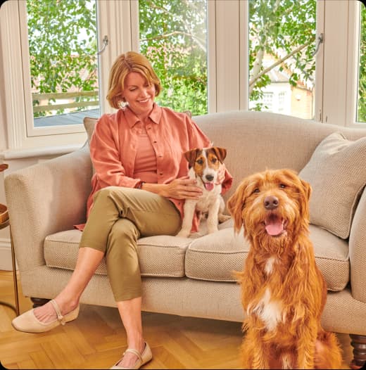 Happy dog owner with her dogs